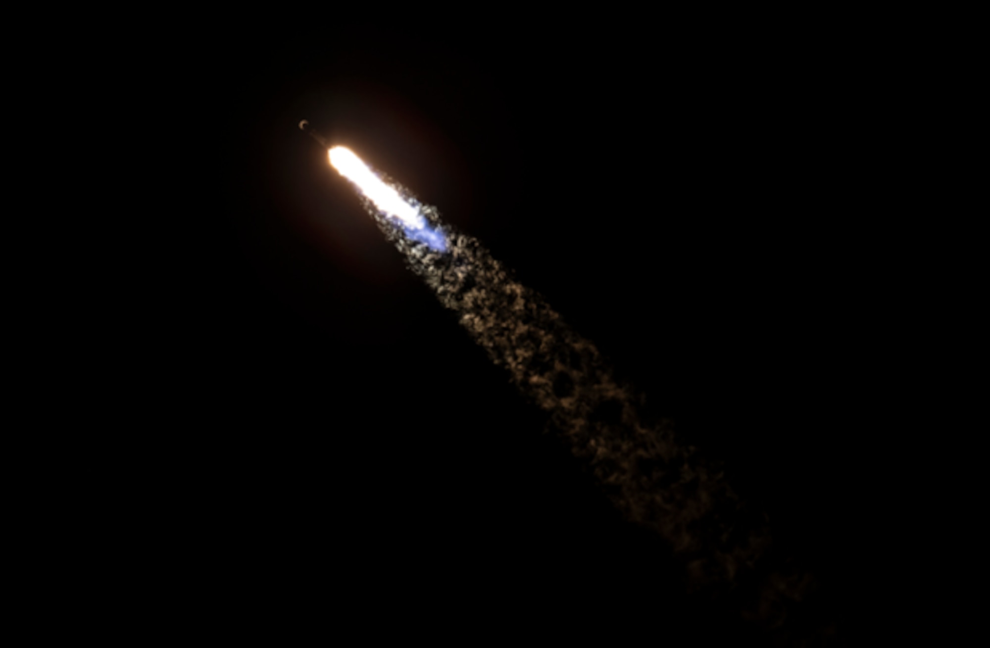 A SpaceX Falcon 9 rocket, carrying the Lockheed Martin-built Global Positioning System (GPS) III-9 SV09 satellite for the U.S. Space Force, arcs over the Atlantic Ocean after successfully lifting off Jan. 27, 2026 at 11:53 p.m. EST (8:53 p.m. PST) from Space Launch Complex 40 (SLC-40), Cape Canaveral Space Force Station, Florida (Photo credit: SpaceX)