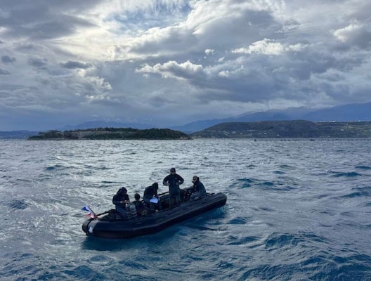 U.S. Navy Seabee divers, assigned to Underwater Construction Team One (UCT 1) Construction Dive Detachment Bravo (CDD/B), prepare to dive in the Sea of Crete Dec. 5, 2025.