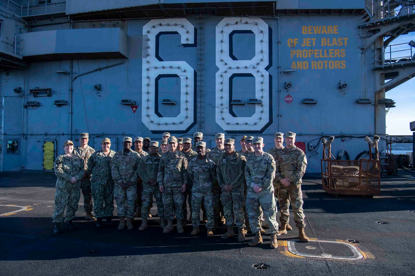 U.S. Airmen and U.S. Soldiers conduct a promotion ceremony aboard the Nimitz-class aircraft carrier USS Nimitz (CVN 68) in Bremerton, Washington, Jan. 16, 2026. Nimitz is in port for a scheduled maintenance availability. (U.S. Navy photo by Mass Communication Specialist 2nd Class Timothy J. Meyer)