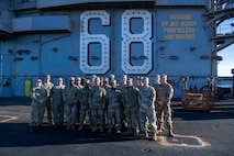 U.S. Airmen and U.S. Soldiers conduct a promotion ceremony aboard the Nimitz-class aircraft carrier USS Nimitz (CVN 68) in Bremerton, Washington, Jan. 16, 2026. Nimitz is in port for a scheduled maintenance availability. (U.S. Navy photo by Mass Communication Specialist 2nd Class Timothy J. Meyer)