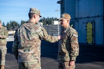 U.S. Airmen and U.S. Soldiers conduct a promotion ceremony aboard the Nimitz-class aircraft carrier USS Nimitz (CVN 68) in Bremerton, Washington, Jan. 16, 2026. Nimitz is in port for a scheduled maintenance availability. (U.S. Navy photo by Mass Communication Specialist 2nd Class Timothy J. Meyer)