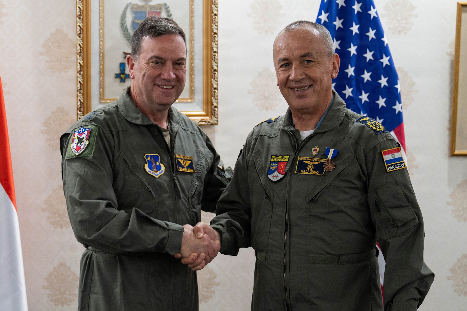 U.S. Air Force Maj. Gen. Gary Keefe, the adjutant general of the Massachusetts National Guard, left, awards Paraguayan Air Force Commander Gen. Julio Rubén Fullaondo Céspedes with the Medal of Merit in Asunción, Paraguay, Jan. 21, 2026. The award recognizes Fullaondo’s leadership and contributions to strengthening aviation cooperation, interoperability and international partnerships between the Massachusetts National Guard and the Paraguayan Armed Forces.