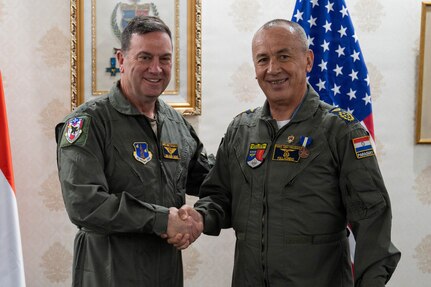 U.S. Air Force Maj. Gen. Gary Keefe, the adjutant general of the Massachusetts National Guard, left, awards Paraguayan Air Force Commander Gen. Julio Rubén Fullaondo Céspedes with the Medal of Merit in Asunción, Paraguay, Jan. 21, 2026. The award recognizes Fullaondo’s leadership and contributions to strengthening aviation cooperation, interoperability and international partnerships between the Massachusetts National Guard and the Paraguayan Armed Forces.