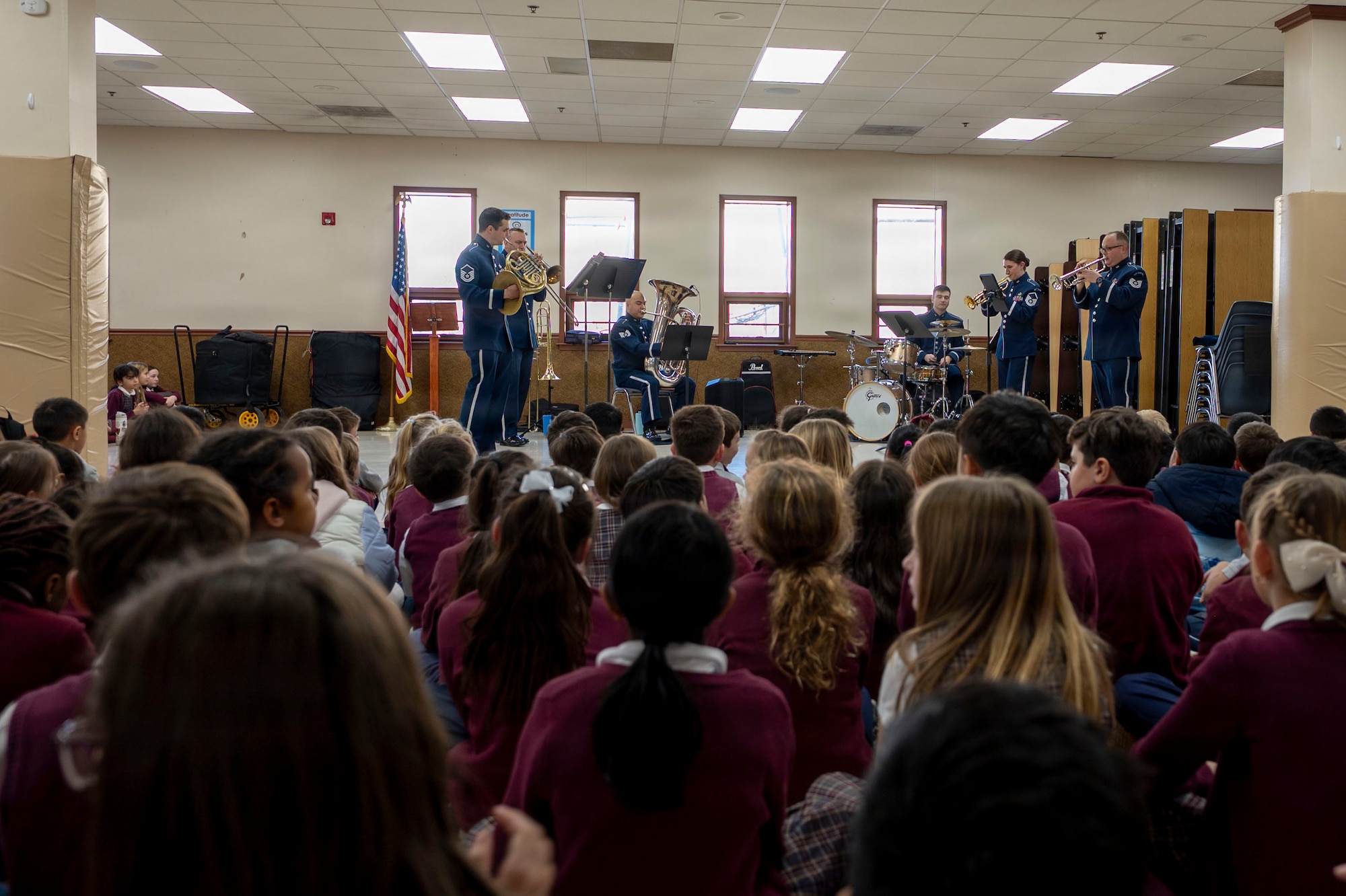 The U.S. Air Force Band’s District Brass plays for students at St. Veronica’s Catholic School, Chantilly, Va., Jan. 13, 2026. The brass quintet and percussionist began doing community outreach in the mid-2010’s in addition to their Arlington National Cemetery duties, as a way of strengthening connections with the surrounding National Capital Region community. (U.S. Air Force photo by Staff Sgt. Jordan Powell)