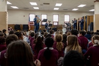 The U.S. Air Force Band’s District Brass plays for students at St. Veronica’s Catholic School, Chantilly, Va., Jan. 13, 2026. The brass quintet and percussionist began doing community outreach in the mid-2010’s in addition to their Arlington National Cemetery duties, as a way of strengthening connections with the surrounding National Capital Region community. (U.S. Air Force photo by Staff Sgt. Jordan Powell)