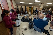 St. Veronica’s Catholic School students perform alongside The Air Force Band’s District Brass in Chantilly, Va., Jan. 13, 2026. The performance immersed the young musicians with professional musicians to inspire musical excellence. (U.S. Air Force photo by Staff Sgt. Jordan Powell)