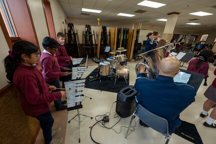 St. Veronica’s Catholic School students perform alongside The Air Force Band’s District Brass in Chantilly, Va., Jan. 13, 2026. The performance immersed the young musicians with professional musicians to inspire musical excellence. (U.S. Air Force photo by Staff Sgt. Jordan Powell)
