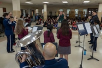 Students at St. Veronica’s Catholic School perform alongside The Air Force Band’s District Brass in Chantilly, Va., Jan. 13, 2026. The District Brass group was formed eight years ago to extend the outreach mission of the Ceremonial Brass to the local community. (U.S. Air Force photo by Staff Sgt. Jordan Powell)