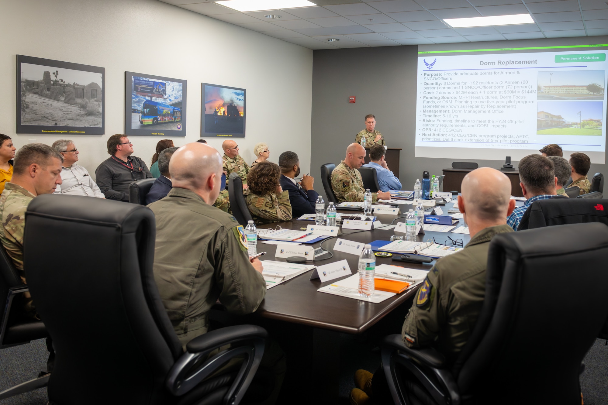 Col. Brad Bucholz, 412th Civil Engineer Group commander, briefs 412th Test Wing leadership on the proposals developed from a "Housing Sprint" workshop on Edwards Air Force Base, Jan. 15. The weeklong workshop included representatives from the Office of the Assistant Secretary of the Air Force, Installation and Environment, Air Force Installation and Mission Support Center, Air Force Civil Engineer Center and Mayroad private housing aimed at solving the critical housing shortage at Edwards AFB. (Photo by Giancarlo Casem)