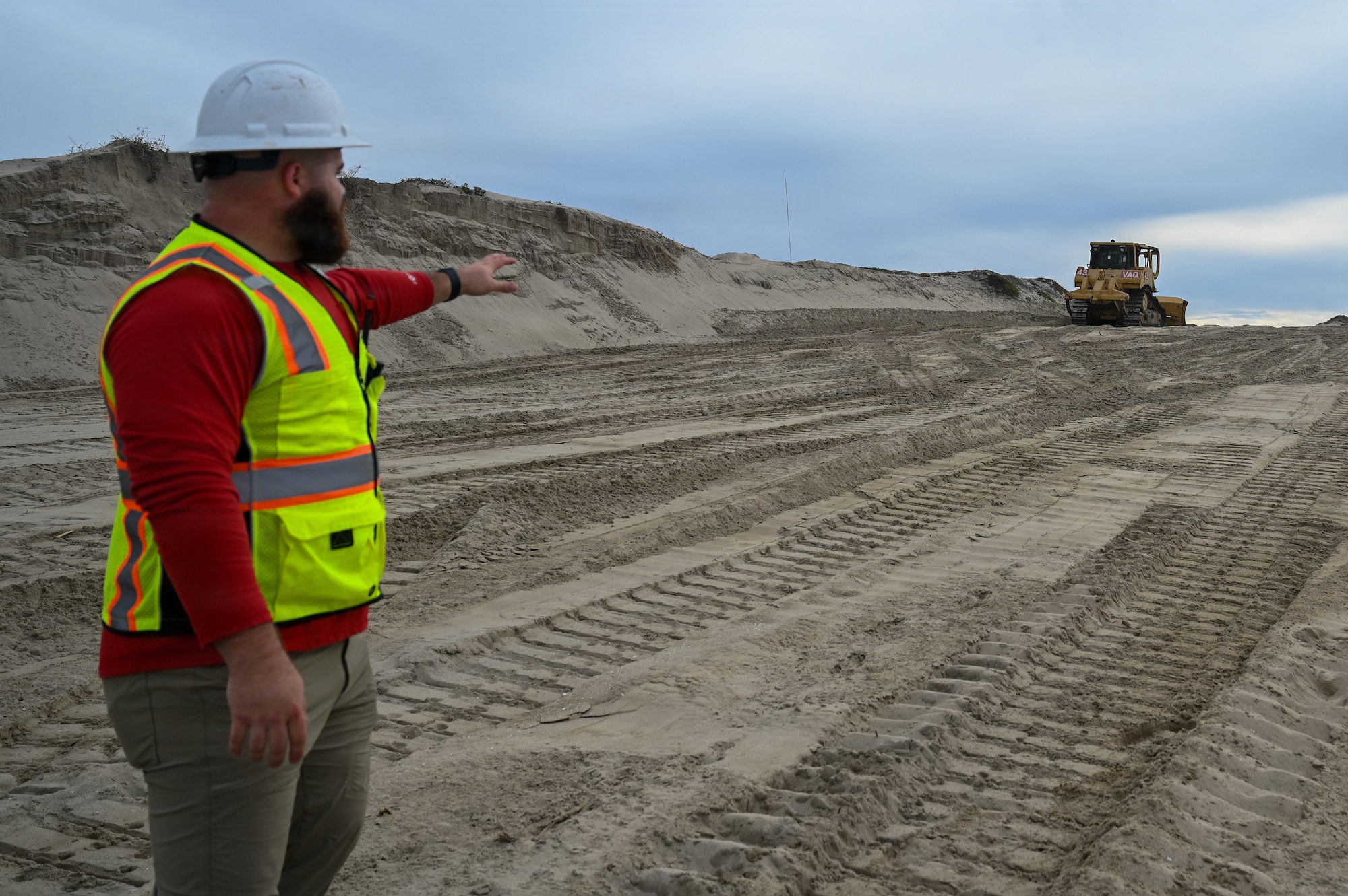 Jackson Taylor, 30th Civil Engineer Squadron biological scientist, stands on one of the contour dune plots at Wall Beach at Vandenberg Space Force Base.