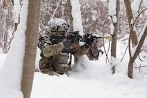 U.S. Army Sgt. Zach Graves, 3rd Battalion, 509th Parachute Infantry Regiment, 2nd Infantry Brigade Combat Team, 11th Airborne Division, patrols the woods as part of a squad movement under fire exercise for North Wind 26, at Hokudai-en in Hokkaido, Japan, Jan. 25, 2026.
