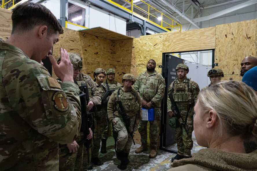 A group of airmen being briefed