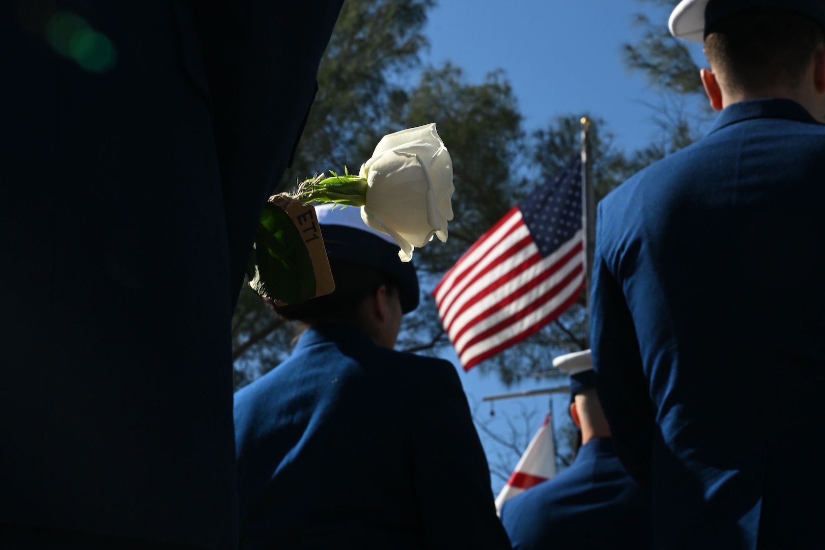 A Coast Guard Petty Officer lays a rose at the memorial of the USCGC Blackthorn, Jan 28. 2026, St. Petersburg, Florida. 23 roses were laid here in honor of the 23 crew members who perished aboard Cutter Blackthorn on January 28, 1980. (U.S. Coast Guard photo by Petty Officer 1st Class Riley Perkofski)
