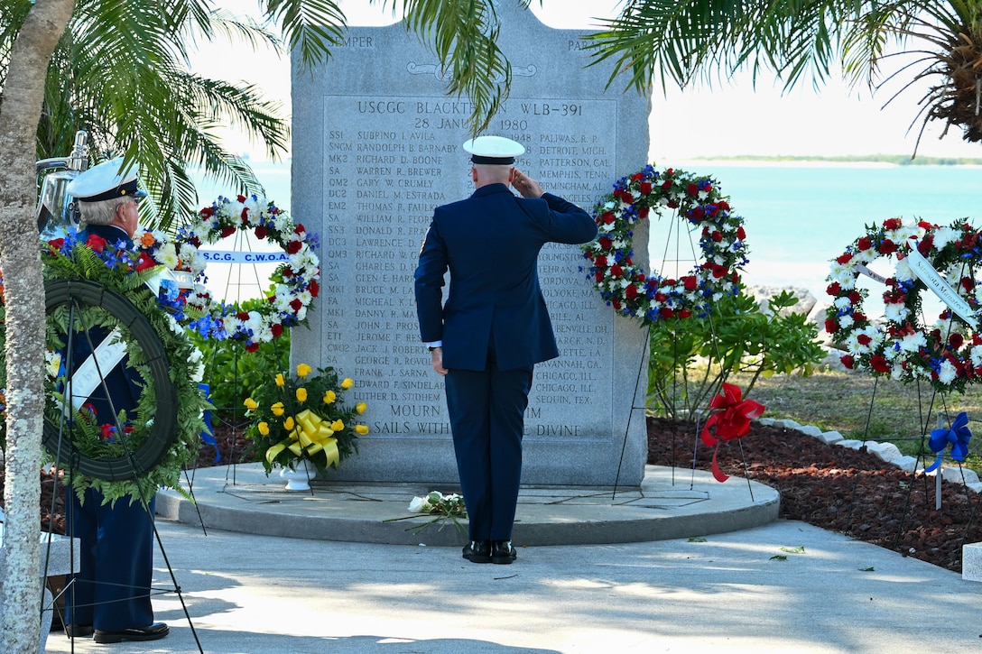 A Coast Guard Chief Petty Officer salutes at the memorial of the USCGC Blackthorn in St. Petersburg, Florida on Jan. 28, 2026.  Out of about 50 crew members, 23 members of the USCGC Blackthorn passed away in the disaster. (U.S. Coast Guard photo by Petty Officer 1st Class Riley Perkofski)