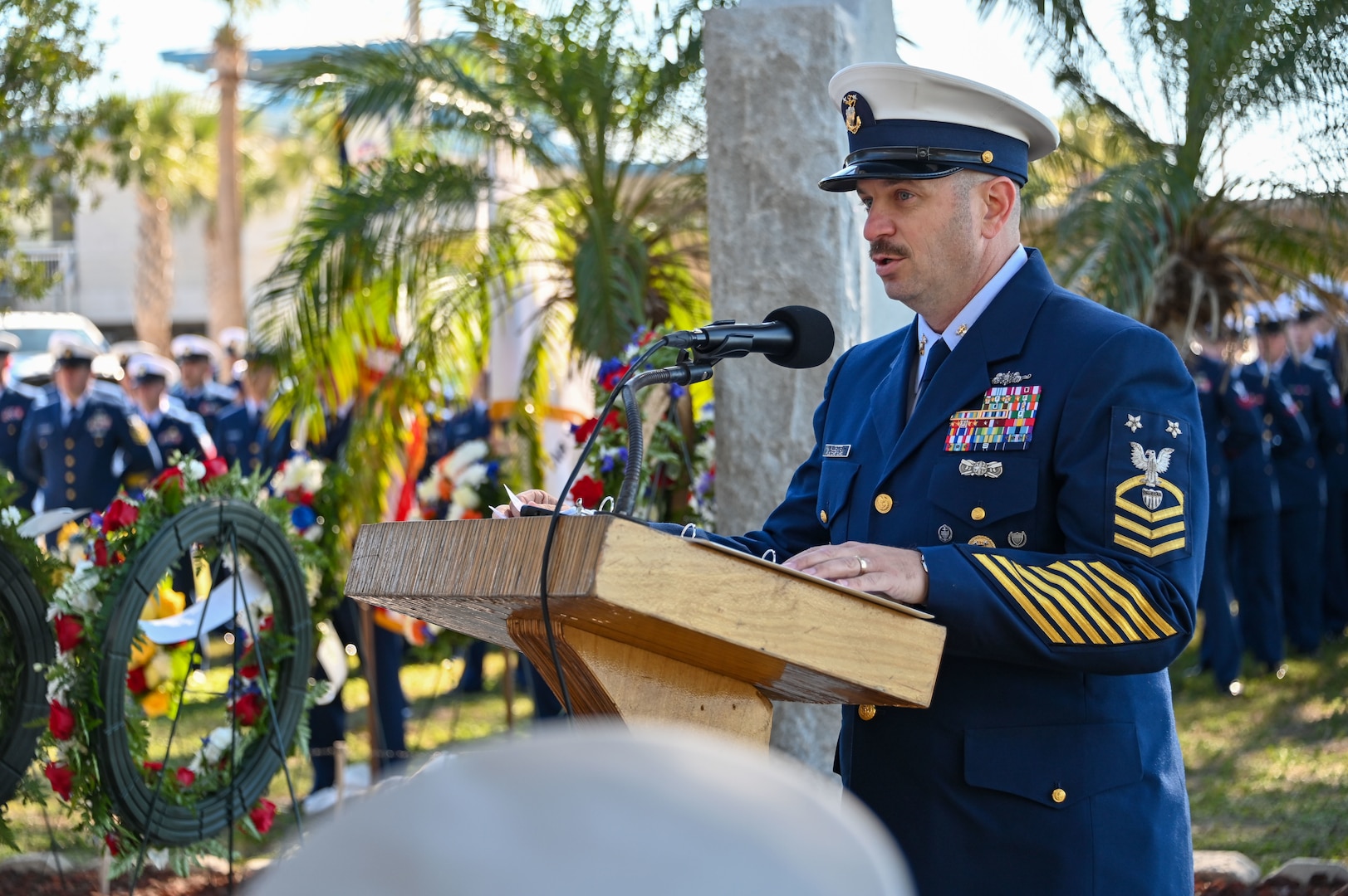 Master Chief Petty Officer Henry J. Audette Jr., Southeast District command master chief, speaks to guests at the USCGC Blackthorn memorial in St. Petersburg, Florida on Jan. 28, 2026. William R. “Billy” Flores, a crewmember of USCGC Blackthorn, remained aboard to release and hold open the life jacket locker, helping others survive; he died and was later posthumously awarded the Coast Guard Medal. (U.S. Coast Guard photo by Petty Officer 2nd Class Ilian Borrero-Aguirre)