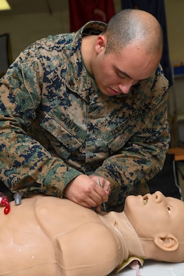260122-N-FB730-1018 CAMP LEJEUNE. (January 22, 2026) A Hospital Corpsman does a cricothyrotomy on a manikin during a skill sustainment training with the Healthcare Simulation and Bioskills Center on January 22, 2026. The training focused on life saving medical techniques needed to ensure Sailors provide efficient medical care. (U.S. Navy photo by Mass Communications Specialist second class Justin Woods)