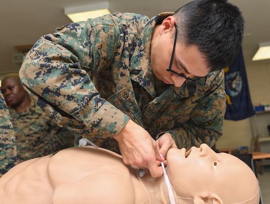 260122-N-FB730-1045 CAMP LEJEUNE. (January 22, 2026) A Hospital Corpsman does a cricothyrotomy a manikin during a skill sustainment training with the Healthcare Simulation and Bioskills Center on January 22, 2026. The training focused on life saving medical techniques needed to ensure Sailors provide efficient medical care. (U.S. Navy photo by Mass Communications Specialist second class Justin Woods)