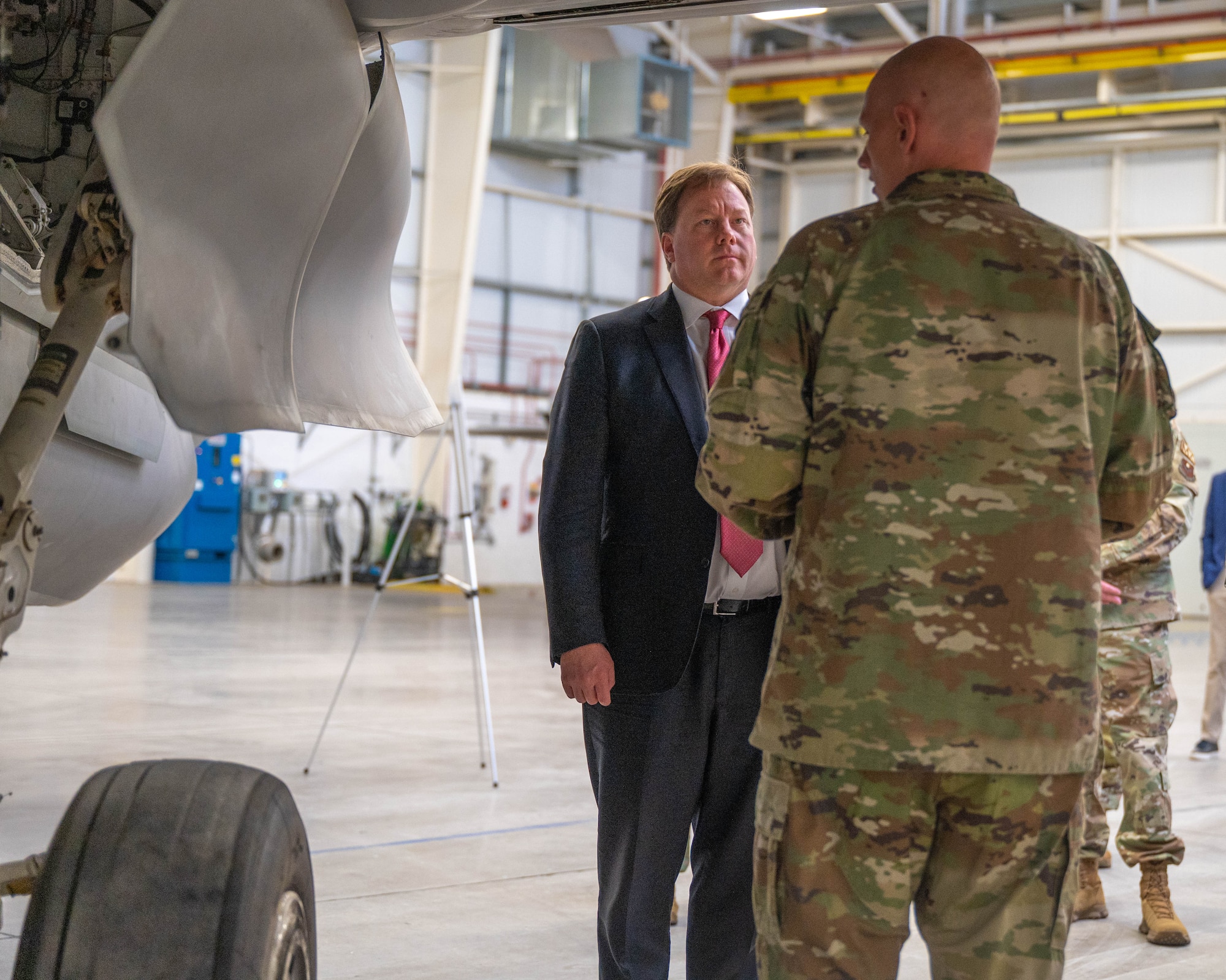 The Honorable Michael Duffey (left), Under Secretary of War for acquisition and sustainment, discusses aircraft maintenance operations with U.S. Air Force Chief Master Sgt. Robert Wilson (right), 62nd Aircraft Maintenance Unit senior enlisted leader, Jan. 21, 2026, at Luke Air Force Base, Arizona.