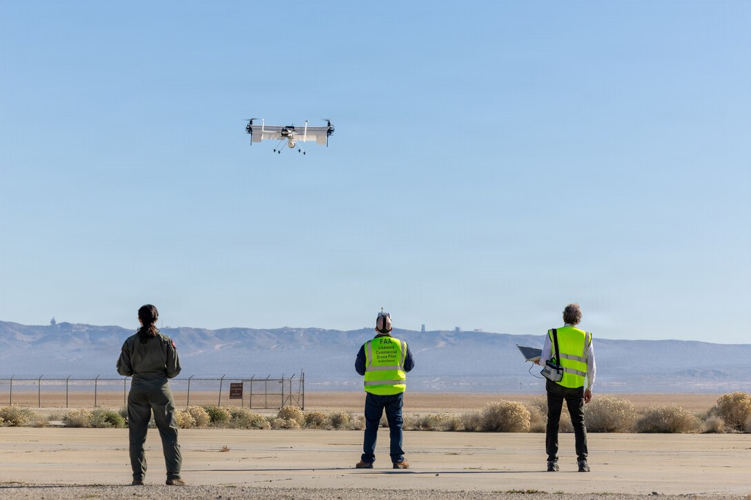 Members of the Experimental Test Force and private industry conduct a performance-based sUAS experiment during the inaugural "Game of Drones" event held at Edwards AFB, CA Dec. 8-12. The week-long effort brought together six industry partners and engineers from the Air Force Research Laboratory to conduct live experimentation of emerging small unmanned aerial systems (sUAS) and associated hardware. As the battlefield continues to diversify, the Department of War has called upon both service and industry to rapidly accelerate testing, acquisition, and production of unmanned systems for the warfighter, referred to as Drone Dominance. “Game of Drones” offers a speed-of-now playbook to meet this intent, going from idea to execution in less than four months. In "Game of Drones", industry partners from emerging to established can rapidly design, 3D-print, and test sUAS systems through agile experimentations across multiple domains such as C2 interoperability, counter-sUAS, rapid field printing, and autonomous swarming. The combination of collaboration and real-time feedback will help users from across the joint services identify key technologies and designs to expand the Department of War’s Blue List, a program that allows for rapid selection of approved unmanned aerial systems.  (Photo by Christian Raterman)