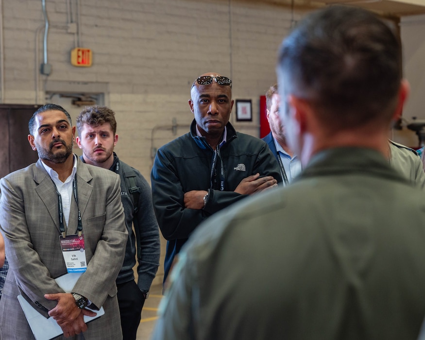 Members of the Department of War Maintenance Symposium listen to a U.S. Air Force F-35A Lightning II pilot speak about the operations of a F-35A, Jan. 20, 2026, at Luke Air Force Base, Arizona.
