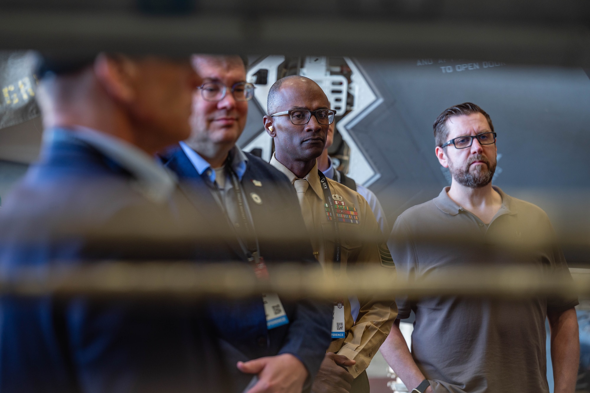 Members of the Department of War Maintenance Symposium, watch a 56th Component Maintenance Squadron load ammunitions on a U.S. Air Force F-35A Lightning II, Jan. 20, 2026, at Luke Air Force Base, Arizona.