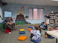 Rob Birke, a supervisory security specialist at Strategic Weapons Facility, Atlantic (SWFLANT), reads “The Tale of Peter Rabbit,” to students at the Camden County Public Library in Kingsland, Ga., on Jan. 21, 2026. The reading was part of SWFLANT’s Storybook STEM series, which offers K-12 students a unique opportunity to learn basic engineering principles from children’s books and understand how they apply to real-world Navy science and technology. (U.S. Navy photo provided)