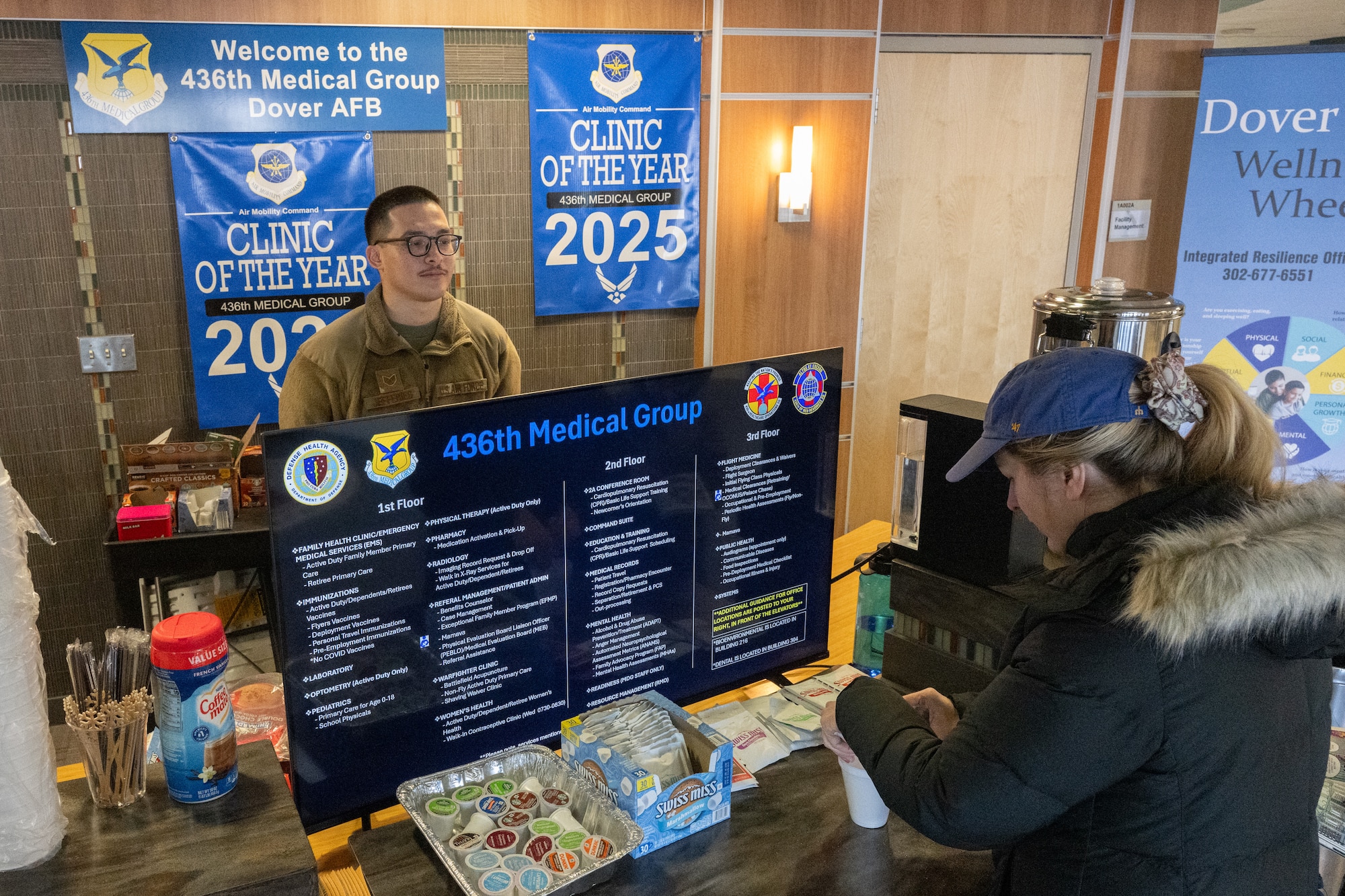 .S. Air Force Staff Sgt. Kevin Jeffries, 436th Healthcare Operations Squadron medical logistics technician, distributes coffee and hot chocolate to clinic patients at Dover Air Force Base, Delaware, Jan. 23, 2026. The 436th Medical Group was recently recognized as the 2025 Air Mobility Command clinic of the year for the second year in a row and rates among the top 5% among 130 medical treatment facilities for overall customer satisfaction. (U.S. Air Force photo by Mauricio Campino)
