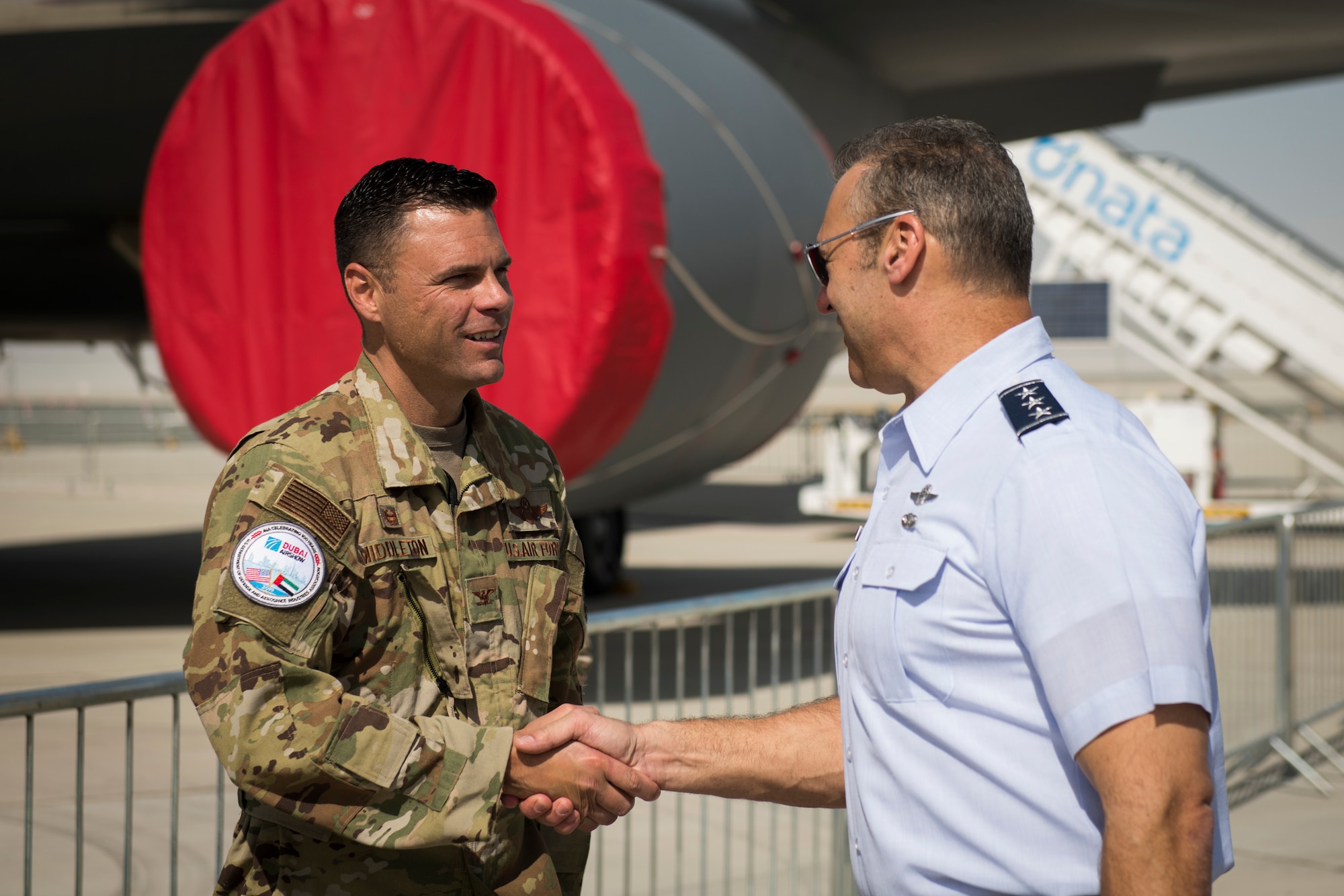 U.S. Air Force Col. Thad Middleton, left, commander of the 22nd Operations Group, greets U.S. Air Force Lt. Gen. Joseph Guastella, commander of U.S. Air Forces Central Command, at the Dubai Airshow, United Arab Emirates, Nov. 17, 2019. The Dubai Airshow, a biennial event, is recognized as the premier aviation and air industry event in the Gulf/Middle East region and is one of the largest air shows in the world. U.S. military participation builds upon our strong relationship with the United Arab Emirates and enhances our relationships with other allies and partners in the region. (U.S. Air Force photo by Staff Sgt. Joseph Pick)