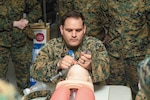 Hospital Corpsman intubates a manikin during a skill sustainment training