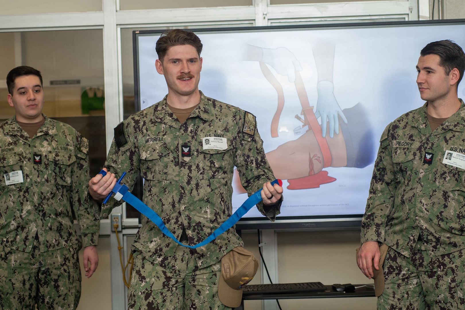 Sailors from Naval Medical Center Portsmouth (NMCP) demonstrate proper tourniquet use to students from local schools during a Stop The Bleed event at the Chesapeake Career Center, Jan. 23, 2025.