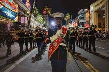 U.S. Marines assigned to Marine Band San Diego perform during the Hollywood Christmas Parade, in Hollywood, California, Nov. 26, 2023. Marine Band San Diego participated in the parade to improve community relations, increase morale, and demonstrate holiday spirit. (U.S. Marine Corps photo by Lance Cpl. Francisco Angel)