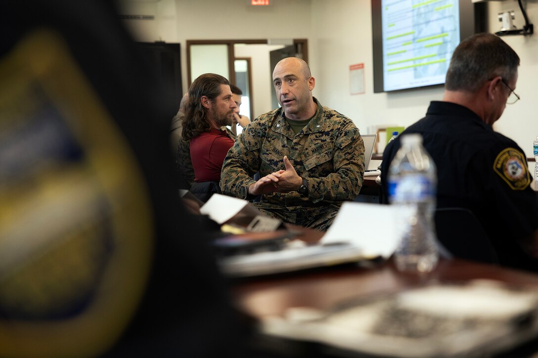 U.S. Marine Corps Lt. Col. Marshall Hand, executive officer, Blount Island Command, engages federal, state, local, military and private-sector partners during an integrated base defense planning preparation session Jan. 15, 2026, at Marine Corps Support Facility Blount Island, Florida. The discussion helped align roles, identify capability gaps and set conditions for a regional planning event Jan. 27–28. (Official Marine Corps photo by Dustin Senger)