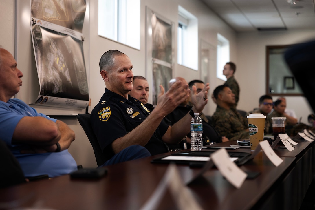 Federal, state, local, military and private-sector partners discuss integrated base defense planning during a preparation session Jan. 15, 2026, at Marine Corps Support Facility Blount Island, Florida. The discussion helped align roles, identify capability gaps and set conditions for a regional planning event Jan. 27–28. (Official Marine Corps photo by Dustin Senger)