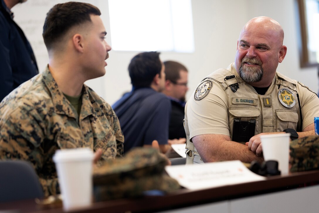 Federal, state, local, military and private-sector partners discuss integrated base defense planning during a preparation session Jan. 15, 2026, at Marine Corps Support Facility Blount Island, Florida. The discussion helped align roles, identify capability gaps and set conditions for a regional planning event Jan. 27–28. (Official Marine Corps photo by Dustin Senger)