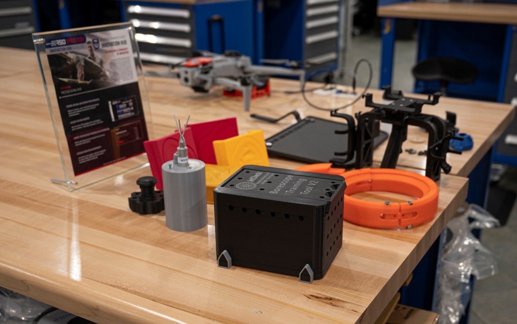 3D printed training tools are displayed in the Mission Enhancement Cell at Joint Base McGuire-Dix-Lakehurst, N.J., Nov. 5, 2025. The MEC's breakthroughs in mission support serve the entire Air Force by expediting timeliness, reducing costs, and improving efficiency. (U.S. Air Force photo by Airman 1st Class Luisa E. Dugan)