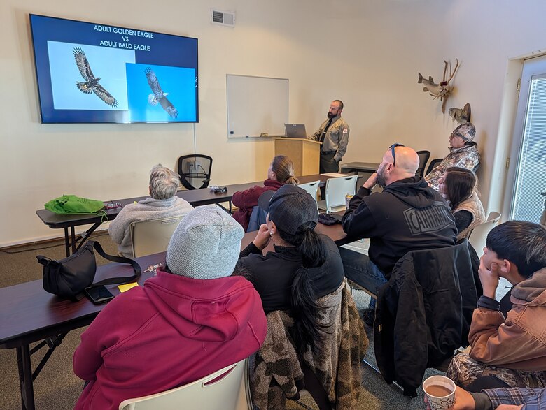 Benjamin Massey (at the podium), lead Cochiti Lake park ranger, gives a presentation on how to differentiate between bald and golden eagles to volunteers at the lake’s Visitor Center during the midwinter eagle survey at Cochiti Lake, Jan. 10, 2026. Seven eagles were observed during the event.