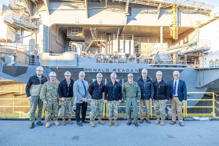 Adm. John Kilby, vice chief of naval operations, poses for a group photo with senior leaders and members of the official party, Jan. 23, 2026, at Puget Sound Naval Shipyard & Intermediate Maintenance Facility in Bremerton, Washington. (U.S. Navy photo by Jeb Fach)