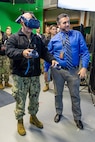 Adm. John Kilby, vice chief of naval operations, tests a virtual reality simulator with the help of Jason Fraser, deputy engineering & planning, Code 201, Engineering & Planning, Jan. 23, 2026, at Puget Sound Naval Shipyard & Intermediate Maintenance Facility in Bremerton, Washington. (U.S. Navy photo by Jeb Fach)