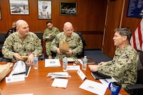 Adm. John Kilby, vice chief of naval operations (middle), and Rear Adm. Christopher Nash, commander, Submarine Group Nine, meet with Capt. JD Crinklaw, commander, Puget Sound Naval Shipyard & Intermediate Maintenance Facility, Jan. 23, 2026, in Bremerton, Washington. (U.S. Navy photo by Jeb Fach)