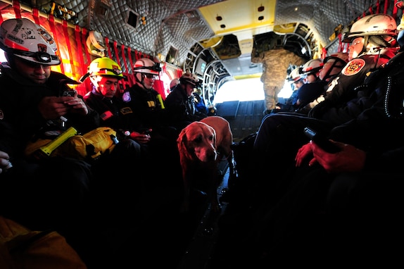 JOINT BASE MCGUIRE-DIX-LAKEHURST, N.J. – Members of Maryland Urban Search and Rescue Task Force one fly aboard a U.S. Army CH-47 helicopter assigned to the Georgia Army National Guard from Joint Base McGuire-Dix-Lakehurst, N.J. to Staten Island, N.Y. to conduct house-to-house searches, Nov 3, 2012.  Maryland Task Force one is part of the National Search and Rescue Task Force recovery effort in the aftermath of hurricane Sandy.  (U.S. Air Force photo by Tech. Sgt. Parker Gyokeres/Released)