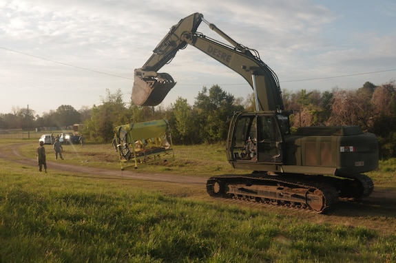 AUGUSTA, Ga., March 28, 2017 - Georgia Army National Guard Soldiers of the 877th Engineer Company move a sand bag machine into position to facilitate repair of a damaged levee during Vigilant Guard 17.

Georgia National Guard photo by Spc. Jordan Trent / released