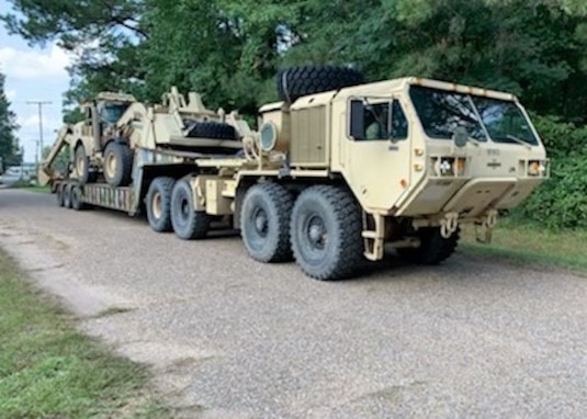 The first convoys of Georgia National Guard vehicles and personnel arrive in Minden, Louisiana, throughout the evening of Sept. 2, 2021. These Citizen-Soldiers and Airmen have assembled from units across the state from Toccoa in the north, Augusta in the east and Fort Stewart in the south. The units bring engineering and debris clearing equipment and expertise, transportation assets and security personnel. (U.S. Army National Guard photo by Command Sgt. Maj. Timothy Baker)