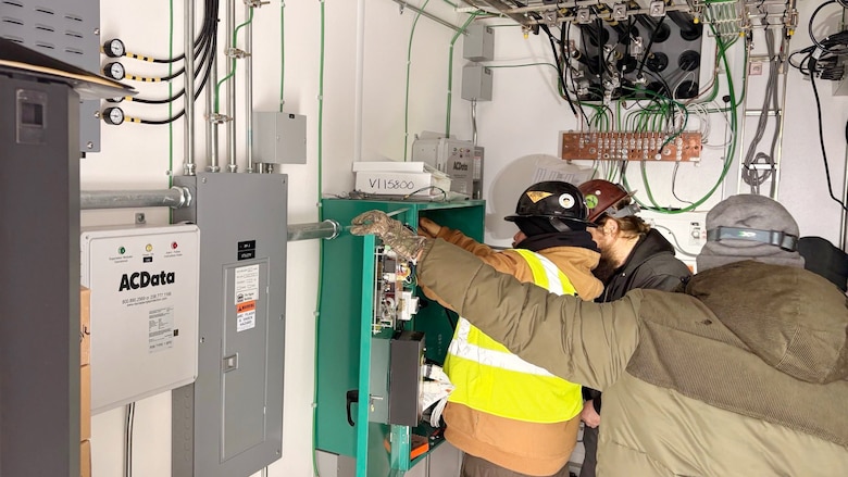 A power team from the U.S. Army Corps of Engineers Tulsa District works to connect power from a generator at a communications tower in Bethel Springs, Tennessee, Jan. 29, 2026, to ensure first responders can communicate and coordinate recovery efforts. The USACE Nashville District’s emergency managers are supporting this effort as part of a FEMA mission assignment with Task Force Temporary Emergency Power. (USACE Photo by Matt Phelan)