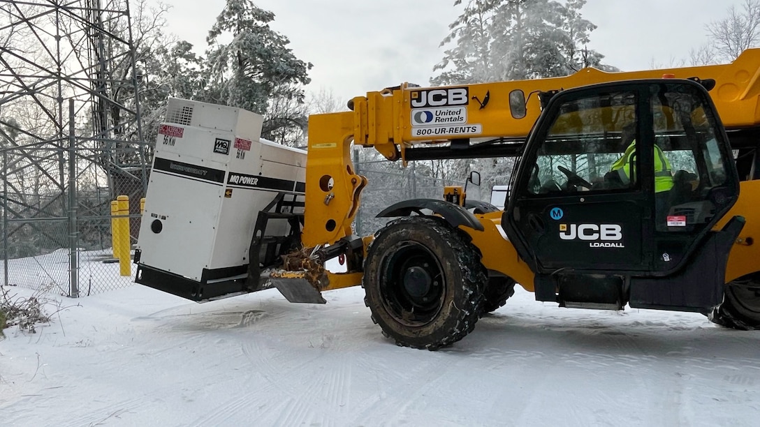 A power team from the U.S. Army Corps of Engineers Tulsa District moves a power generator into position at a communications tower in Bethel Springs, Tennessee, Jan. 29, 2026, to ensure first responders can communicate and coordinate recovery efforts. The USACE Nashville District’s emergency managers are supporting this effort as part of a FEMA mission assignment with Task Force Temporary Emergency Power. (USACE Photo by Matt Phelan)