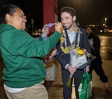 Trent Michel, marine electrician, Puget Sound Naval Shipyard & Intermediate Maintenance Facility San Diego Detachment, receives a congratulatory lei, Jan. 22, 2026, following the 2026 Southwest Regional Apprentice Program graduation ceremony at Southwestern College, Chula Vista, Calif. (U.S. Navy photo by Wendy Hallmark)