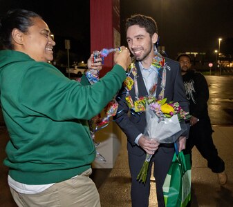 Trent Michel, marine electrician, Puget Sound Naval Shipyard & Intermediate Maintenance Facility San Diego Detachment, receives a congratulatory lei, Jan. 22, 2026, following the 2026 Southwest Regional Apprentice Program graduation ceremony at Southwestern College, Chula Vista, Calif. (U.S. Navy photo by Wendy Hallmark)