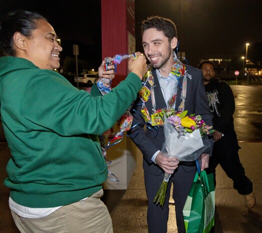 Trent Michel, marine electrician, Puget Sound Naval Shipyard & Intermediate Maintenance Facility San Diego Detachment, receives a congratulatory lei, Jan. 22, 2026, following the 2026 Southwest Regional Apprentice Program graduation ceremony at Southwestern College, Chula Vista, Calif. (U.S. Navy photo by Wendy Hallmark)