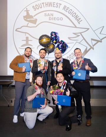 Six apprentices with Puget Sound Naval Shipyard & Intermediate Maintenance Facility San Diego Detachment pose for a photo Jan. 22, 2025, following the 2026 Southwest Regional Apprentice Program graduation ceremony at Southwestern College, Chula Vista, California.