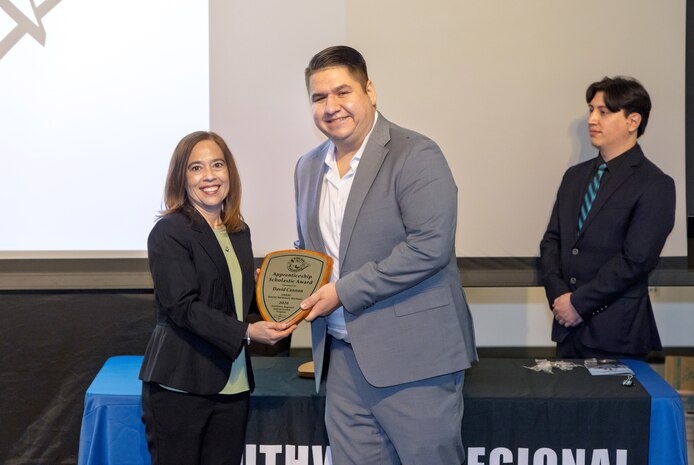 David Cannon, marine machinery mechanic, Southwest Regional Maintenance Center, receives the 2026 Apprenticeship Scholastic Award, Jan. 22, 2026, during the 2026 Southwest Regional Apprentice Program graduation ceremony at Southwestern College, Chula Vista, California. (U.S. Navy photo by Wendy Hallmark)