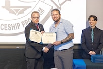 Mitchell Lamb, right, marine electrician, PSNS & IMF San Diego Detachment, receives his certificate, Jan. 22, 2026, during the 2026 Southwest Regional Apprentice Program graduation ceremony at Southwestern College, Chula Vista, California. (U.S. Navy photo by Wendy Hallmark)